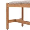 Slender wooden bench with boucle finish seat