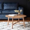 Round wooden coffee table in minimalist design