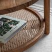 Wooden coffee table with lower rattan shelf