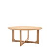 Round wooden coffee table with shaped underframe