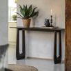 Wooden console table with arch detailing