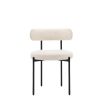 Round seat chair with slim legs and curved back