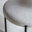 Round seat chair with slim legs and curved back