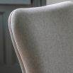 Upholstered curved dining chair with wooden legs