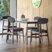 Dining table in walnut stained wood with marble top