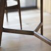 Dining table in walnut stained wood with marble top