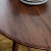 Wooden oval dining table in walnut finish