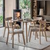 Square wooden dining table with four legs