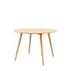 Round wooden dining table with four legs