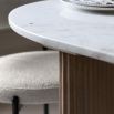 Wood dining table with striking vertical ribbed feature on drum base and polished marble top