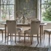Extendable rectangular dining table with bobble effect legs