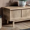 Wooden media unit with rattan detailing