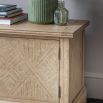 Lightly brushed media unit crafted from Mindy wood with a stunning inlaid parquet-style design