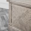 Lightly brushed media unit crafted from Mindy wood with a stunning inlaid parquet-style design