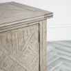 Lightly brushed media unit crafted from Mindy wood with a stunning inlaid parquet-style design