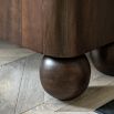 Sideboard with arch patterns and round ball feet