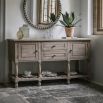 Rustic and sophisticated two door two drawer with detailed legs