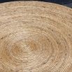 Round coffee table covered in natural rope weave