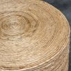 Round coffee table covered in natural rope weave