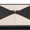 Smoke oak and ribbed ebony two-door cabinet with bowtie motif and accordion-style brass pulls 