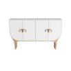 Four-door cabinet in crisp white lacquer with antique brass bullhorn-inspired hardware