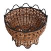 Basket-shaped centrepiece crafted from handmade natural and black rattan vessels