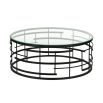 Coffee table with circle of toughened glass supported by base cast in metal