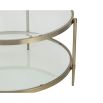 Sturdy coffee table with circular frame, brushed brass finish and glass top