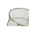 Sturdy coffee table with circular frame, brushed brass finish and glass top