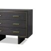 Black wooden chest with three drawers and brass handles