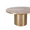 Round dining table with beautiful brushed brass finish and clean white marble