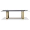 Black grain dining table with sturdy yet delicate polished brass-finished stainless steel legs