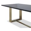 Black grain dining table with sturdy yet delicate polished brass-finished stainless steel legs