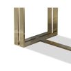 Black grain dining table with sturdy yet delicate polished brass-finished stainless steel legs