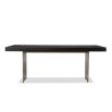 Dining table with rectangular brass legs and stylish top of figured black ash veneer