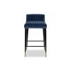 Elegant blue velvet upholstered counter stool with fluted details and brass capped feet