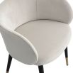 low back wrap around dining chair in white velvet with black legs and brass capped feet