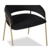 Black velvet upholstered dining chair with brass legs and wraparound backrest and arms