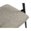 zig zag upholstered armchair with black frame and slanted back legs