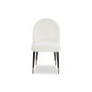 Rounded back dining chair with black legs, brass feet caps and boucle upholstered