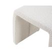 A stylish stool with a contemporary boucle sand upholstery 