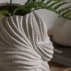 Small ceramic vase which evokes natural forms of nature