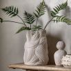 Large ceramic vase which evokes natural forms of nature