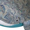 Patterned textile whale with feathery flourish 