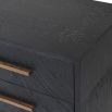 Black wooden bedside table with brass handles