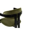 Olive coloured velvet dining chair with three-legged black frame