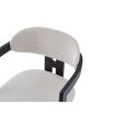 dining chair with Boucle upholstered backrest and seat and black legs and arm rests