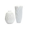 Ridged white vase with spiked top