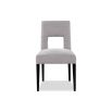 Light grey dining chair with square cut out shape in backrest and luxurious linen upholstery