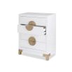 White chest of drawers with circular brass handles and legs